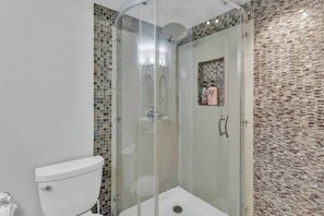 Bathtub, hair dryer, soap, shampoo