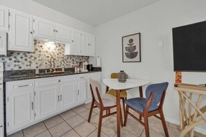 Fridge, microwave, stovetop, coffee/tea maker