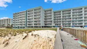 A large, multi-story hotel with a flat roof and balconies.