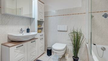 Bathtub, hair dryer, towels