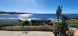 Enjoy breathtaking ocean views from this scenic spot, overlooking the beach and distant shoreline.