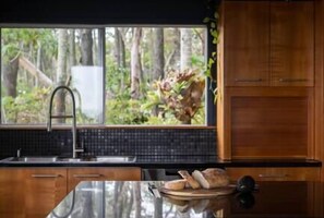 Fridge, microwave, oven, stovetop - Norm’s Place - a secluded, unique, absolute water front property at Amity Point (Amity Point)