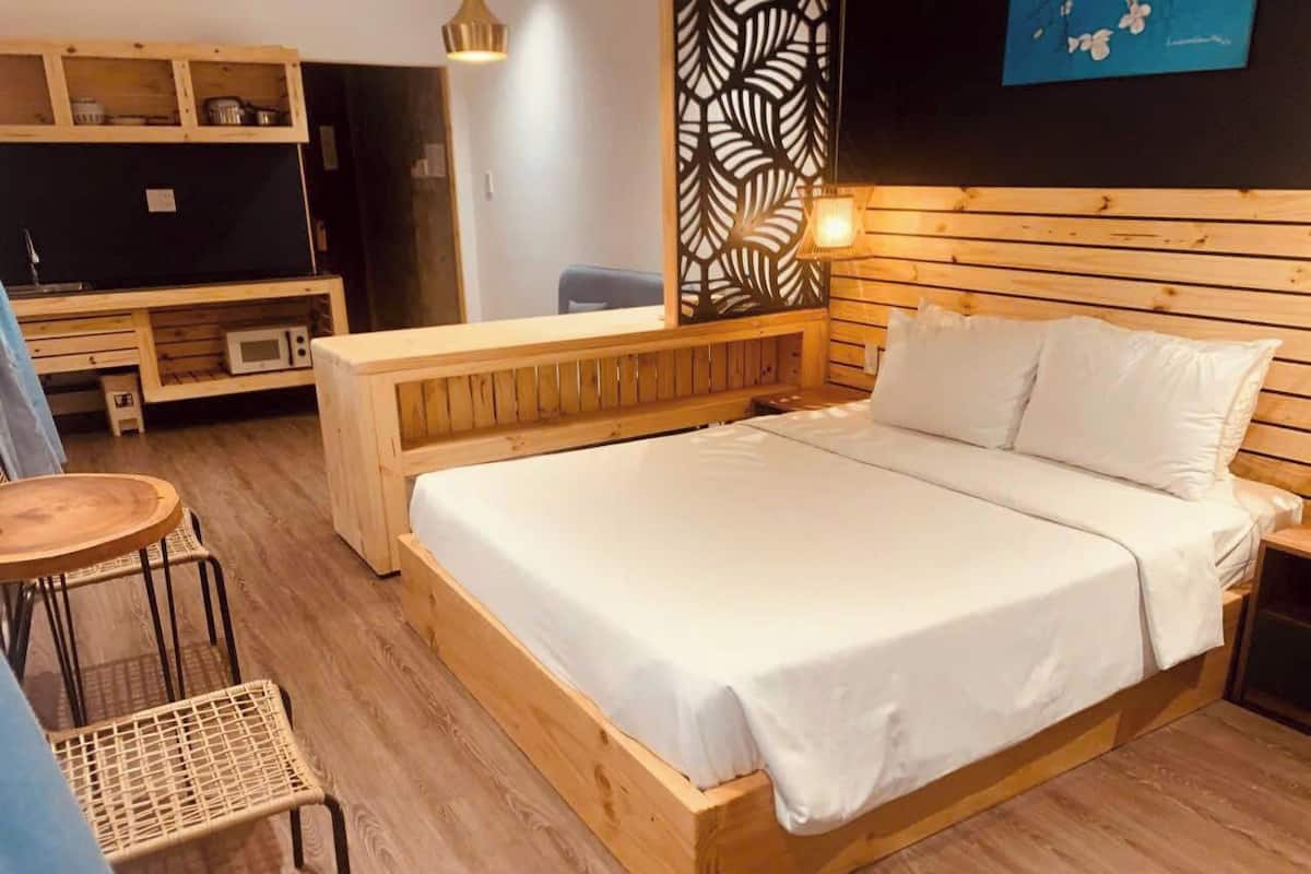 Superior One Bedroom Apartment with Balcony (Stairs Only) | Minibar, blackout drapes, WiFi (free), bed sheets