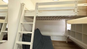 A bunk bed room with a ladder, a mattress, and a window. - Ski-In/Ski-Out Studio with Pool Access at Les Orres 1800 (Les Orres)