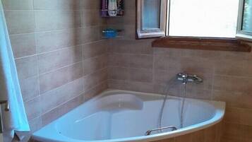 Bathtub, hair dryer, towels