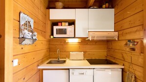 A compact kitchen with a microwave, toaster, sink, and dishwasher. - Chalet "Maison De Bois Finlandaise" with 2 Private Terraces & Balcony (Bolquère)