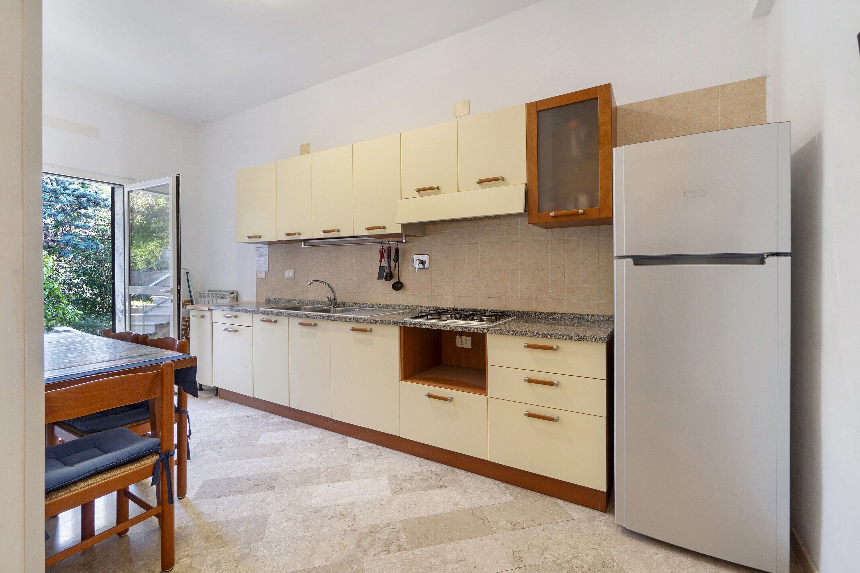 Fridge, stovetop, electric kettle, cookware/dishes/utensils