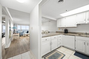 Enjoy ocean views from the kitchen's large window, where you can prepare meals and dine in the adjacent dining area.