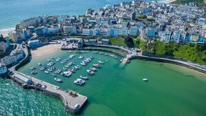 A coastal town with a marina, historic buildings, and a prominent church. - Croft Court - 1 Bedroom Apartment - Tenby (Tenby)