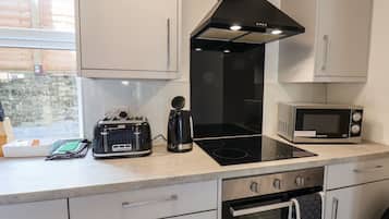 Fridge, electric kettle, toaster, cookware/dishes/utensils