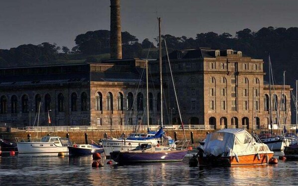 Stunning harbor views with historic landmark and docked boats.