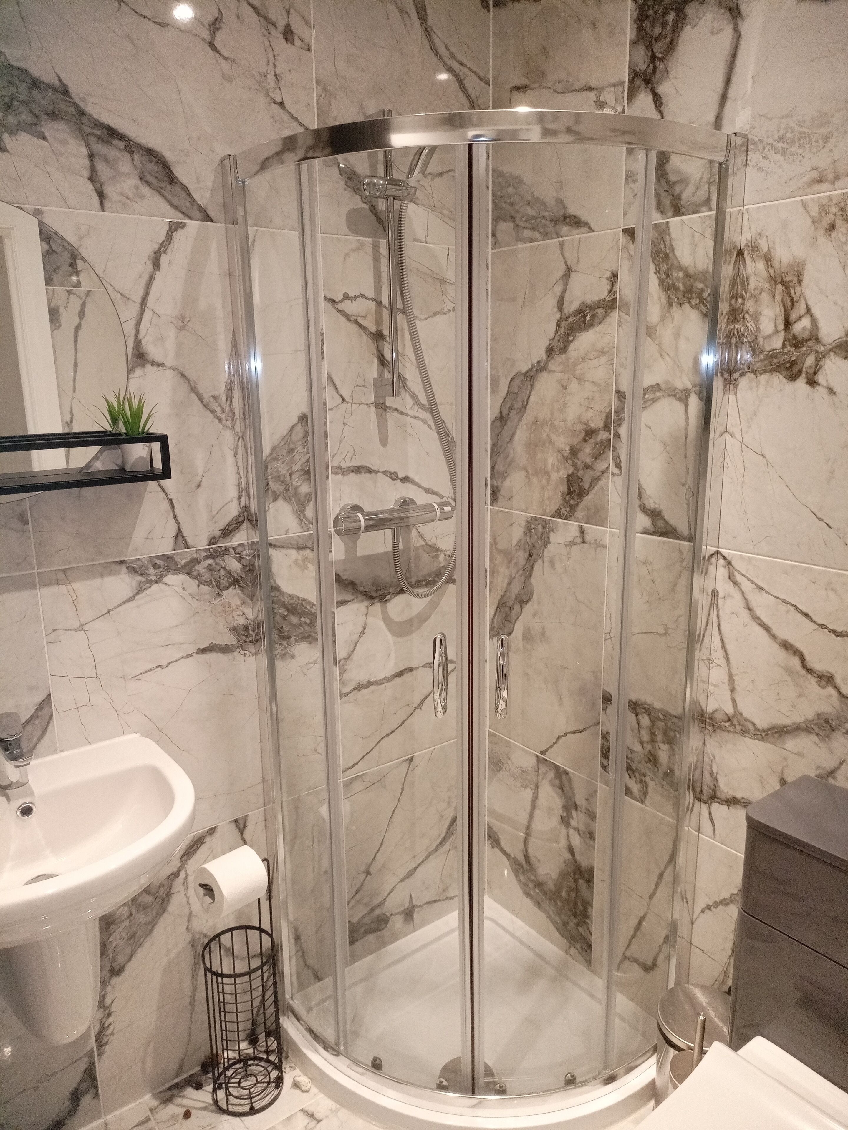 Shower, towels, soap, toilet paper