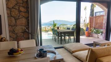 Apartment | Living area | 65-inch Smart TV with satellite channels, TV