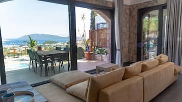 Apartment | Living area | 65-inch Smart TV with satellite channels, TV
