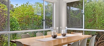 At the end of a quiet beach lane, bordered by National Park and rolling dunes