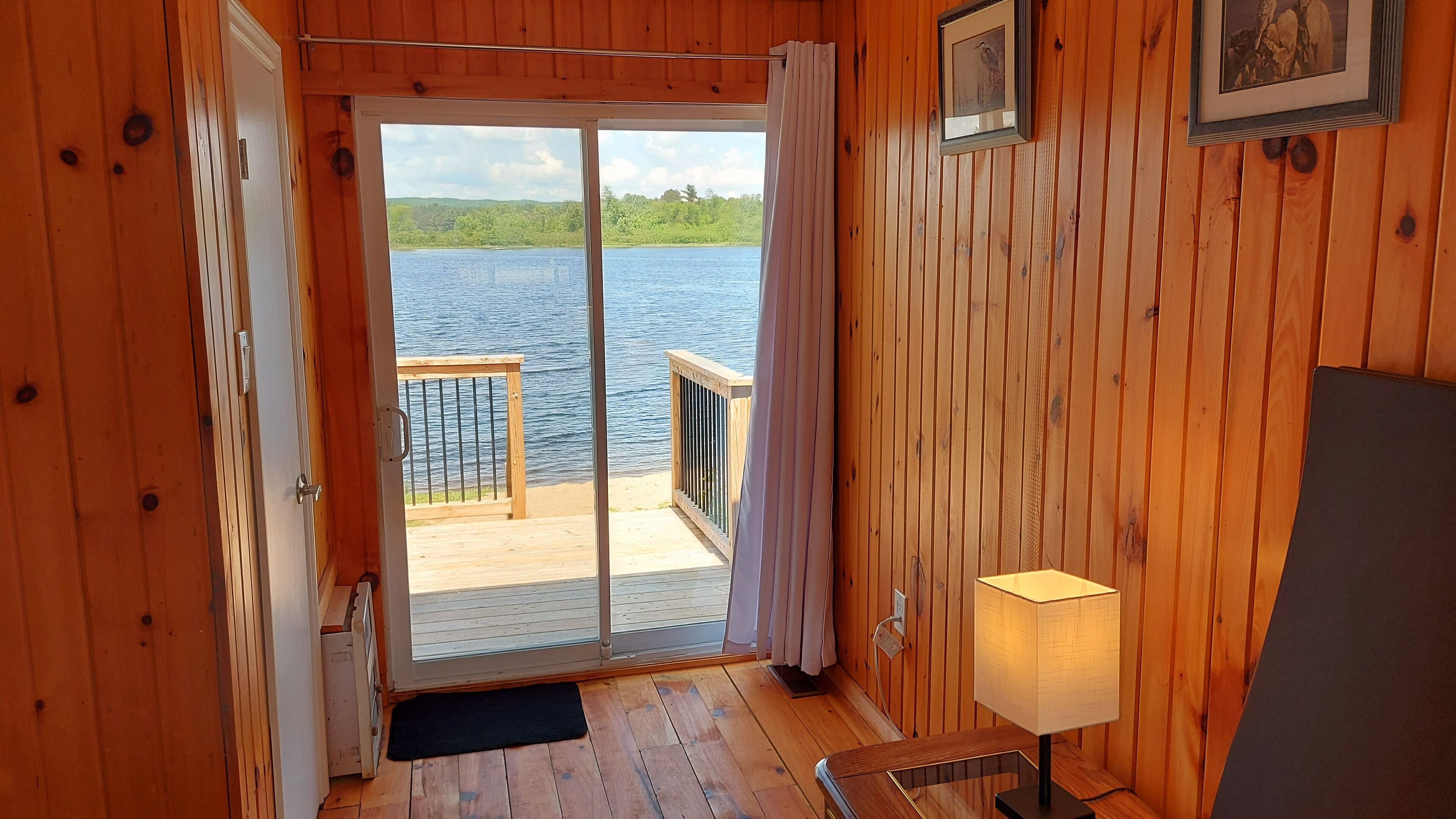 Lake view from 2 bdrm Suite Master Bdrm through the walkout glass doors 
