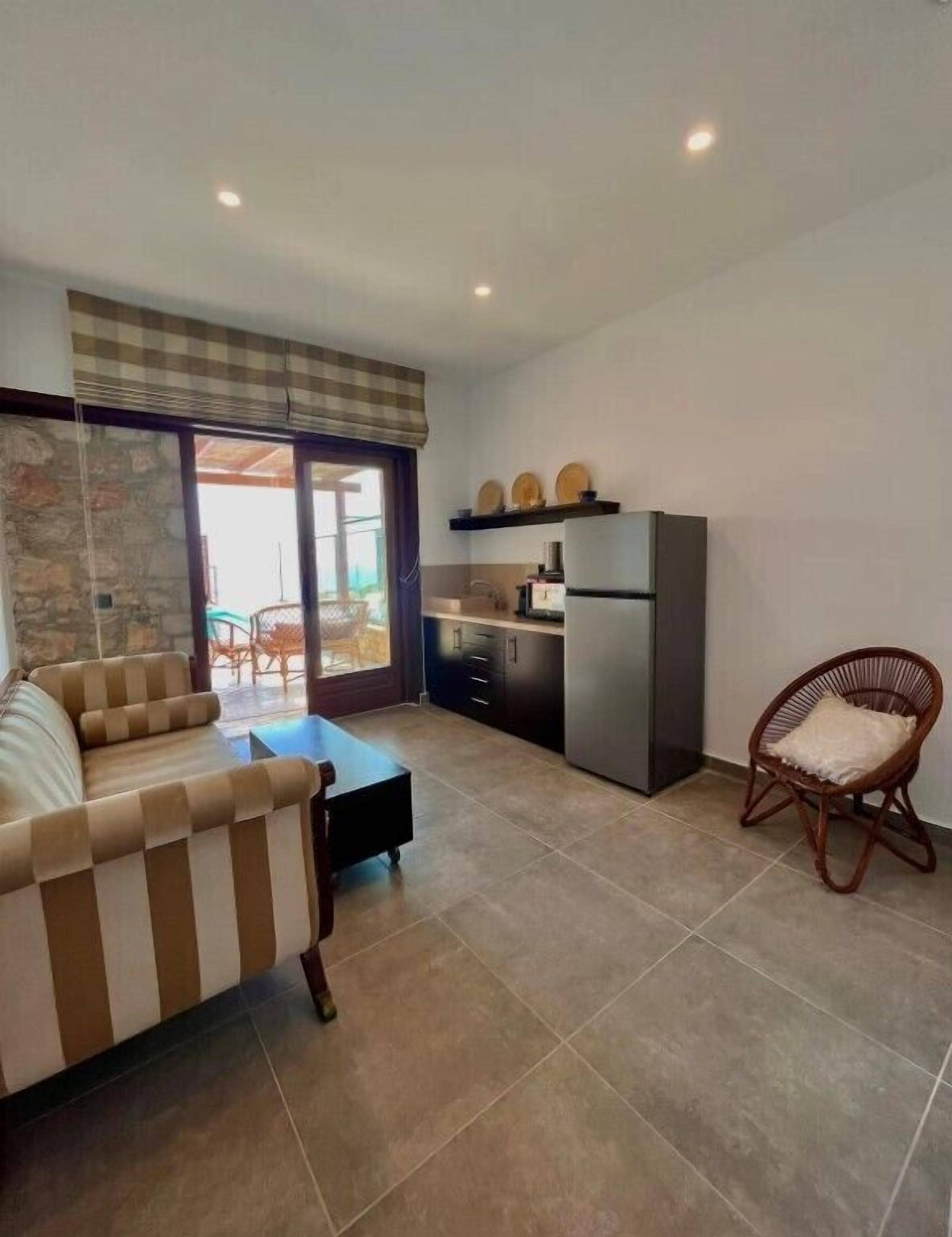Junior Villa | Living area | 35-inch LCD TV with cable channels, TV