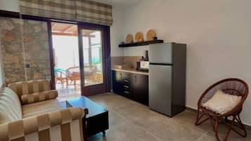 Junior Villa | Living area | 35-inch LCD TV with cable channels, TV