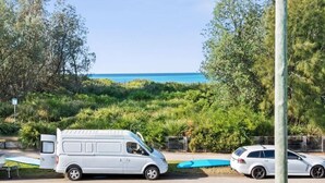 A white van parked near a pool with a view of the ocean. - Ted's at Broulee (Broulee)