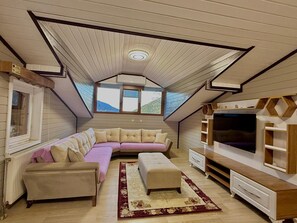 Deluxe Penthouse | Living room | 120-inch Smart TV with satellite channels, TV, heated floors