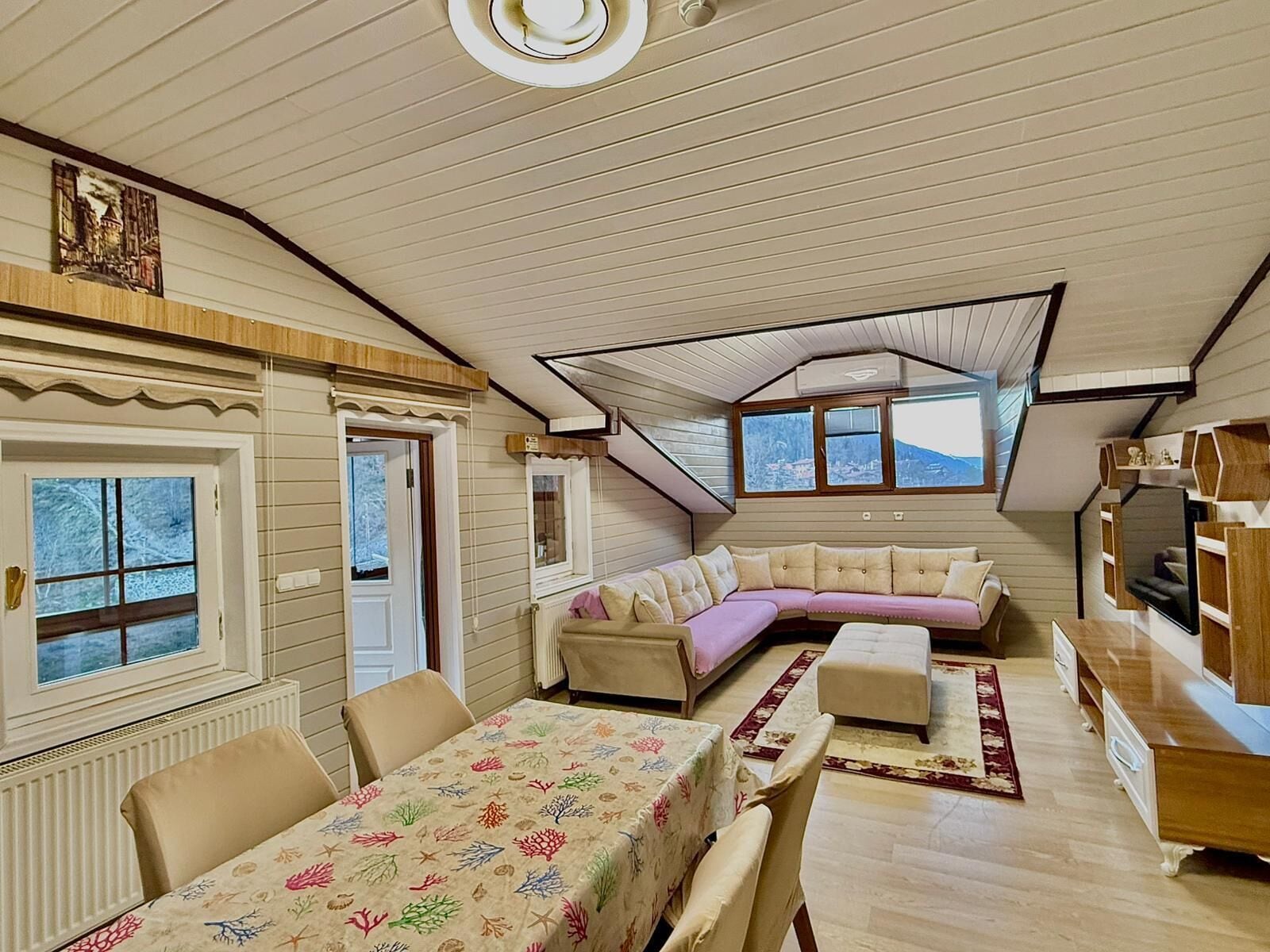 Deluxe Penthouse | Living area | 120-inch Smart TV with satellite channels, TV, heated floors