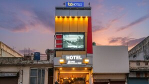 A building with a sign for 'fabHOTELS' and 'HOTEL A ONE INN'. - FabHotel A One Inn (Lucknow)