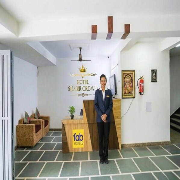 A hotel reception area with a sign for 'Hotel Silver Crown' and 'Fab Hotels'. - FabHotel New Silver Crown (New Delhi)