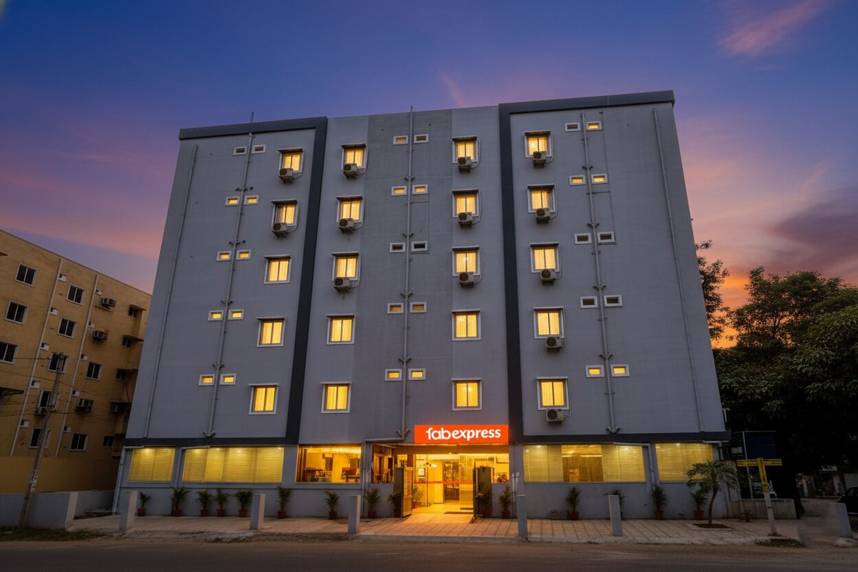 A multi-story hotel with a flat facade, multiple balconies, and a prominent 'Tabexpress' sign at the entrance.