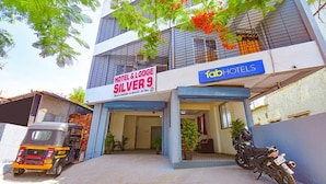 A hotel named 'Hotel & Lodge Silver 9' with a sign indicating it's part of the 'fabHOTELS' chain. - FabHotel Silver 9 (Paud)