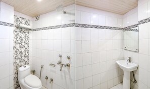 Habitación Deluxe | Baño | Ducha y cabezal de ducha tipo lluvia