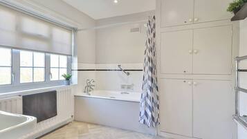 Bathtub, hair dryer, towels
