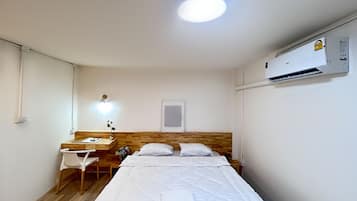 Deluxe Studio (No Window) (1 King Bed) | Desk, blackout curtains, iron/ironing board, free WiFi