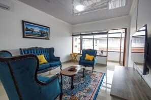 Luxury Apartment | Living area | 43-inch Smart TV with satellite channels, Netflix, streaming services - Safi Self-Catering Suites (East London)