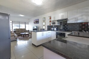 Mini-fridge, microwave, oven, stovetop