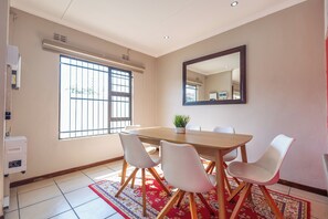 Exclusive Cottage | Living area | 43-inch Smart TV with satellite channels, Netflix, streaming services - Safi Self-Catering Suites (East London)