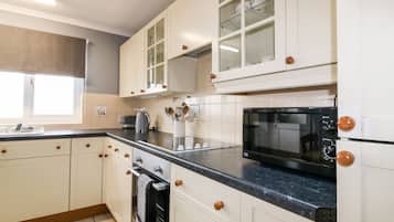 Fridge, electric kettle, toaster, cookware/dishes/utensils