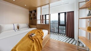 A modern hotel room with a large bed, a wooden ceiling, a balcony with a checkered floor, and a view of the city. - Chongqing Tianfei Art Hotel (Olympic Sports Center Yuanjiagang Subway Station) (Chongqing)