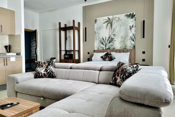 Deluxe Loft | Living area | 43-inch Smart TV with cable channels