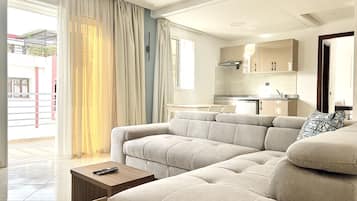 Comfort Penthouse | Living area | 43-inch Smart TV with cable channels