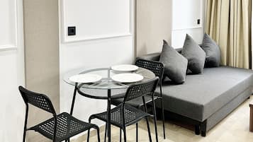 Comfort Apartment | Living area | 43-inch Smart TV with cable channels