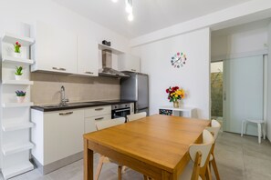 Fridge, stovetop, cookware/dishes/utensils