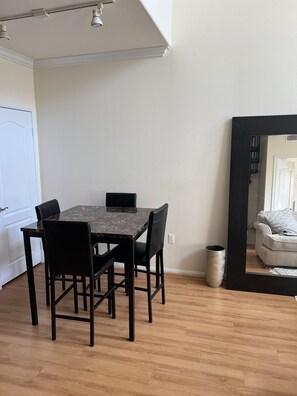 Enjoy meals in this cozy dining area with a table and four chairs.