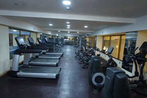 A gym with treadmills, elliptical machines, and weight equipment. - Best Western Premier Dynasty (Addis Ababa)