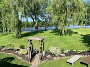 View of the Trent River and lawn from the deck. Beautiful sunrises every morning