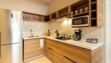 Fridge, microwave, stovetop, coffee/tea maker