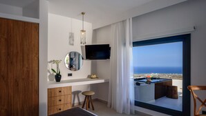A modern bedroom with a large window, a TV, a wooden wardrobe, a bedside table, and a view of the sea. - RyoLithos Suites (Santorini)