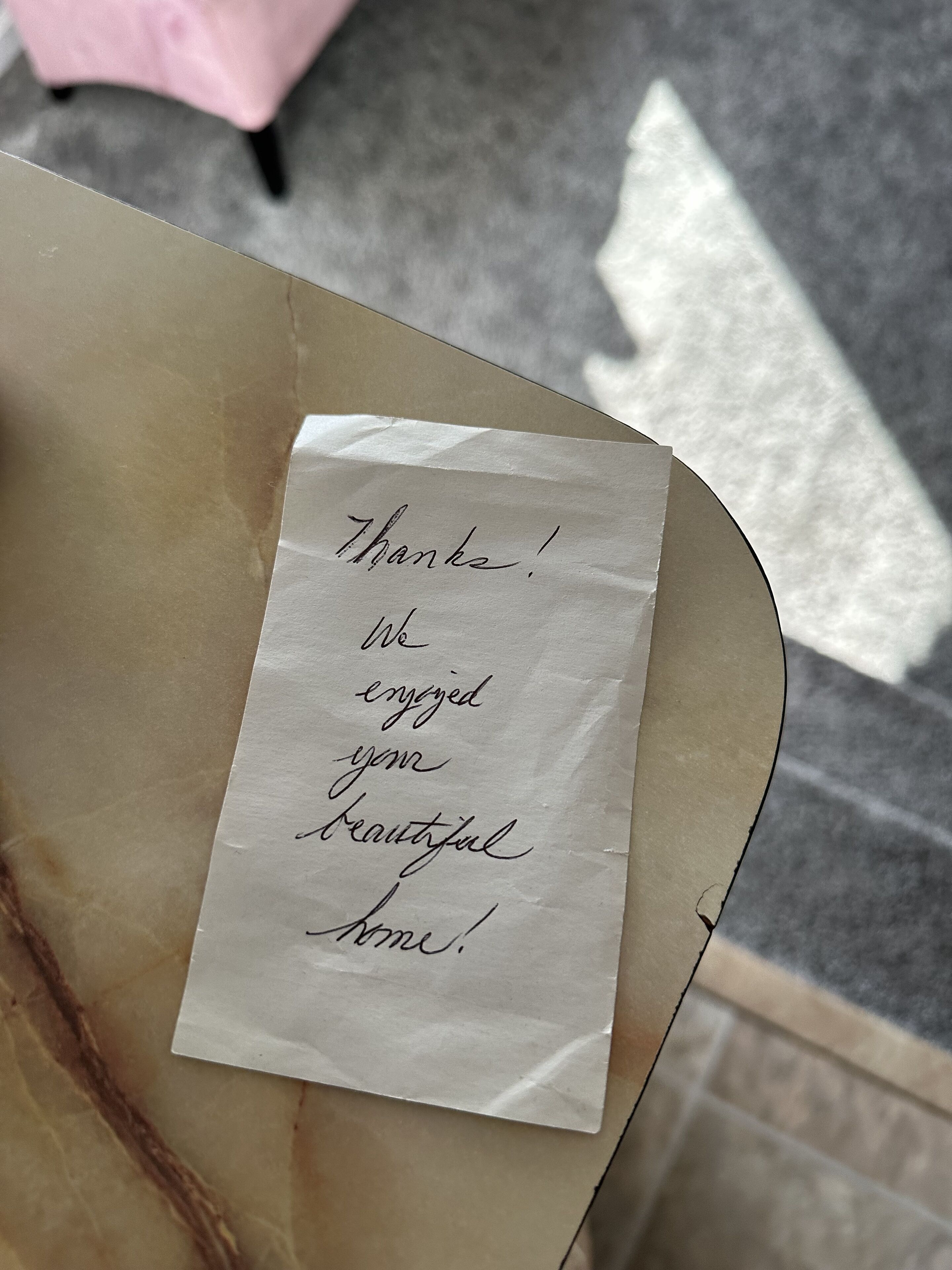 A handwritten note on a piece of paper.