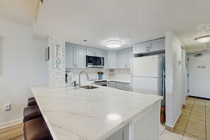 Fridge, microwave, oven, stovetop - Inviting oceanfront condo with balcony, pool, hot tub, sauna, & W/D (Myrtle Beach)
