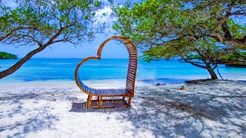 On the beach, white sand, beach shuttle, sun loungers