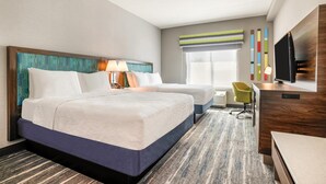 A hotel room with two beds, a desk, a chair, a television, and a window with blinds. - Hampton Inn Fort Myers Downtown (Fort Myers)